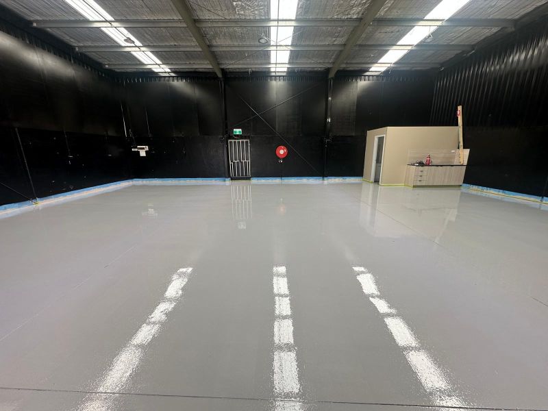 Warehouse epoxy floor grey gloss black walls