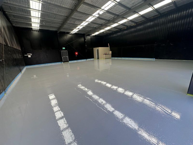 Large warehouse epoxy floor under skylights