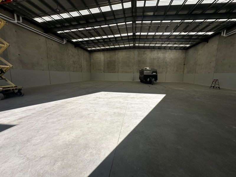 Bare concrete slab before epoxy warehouse