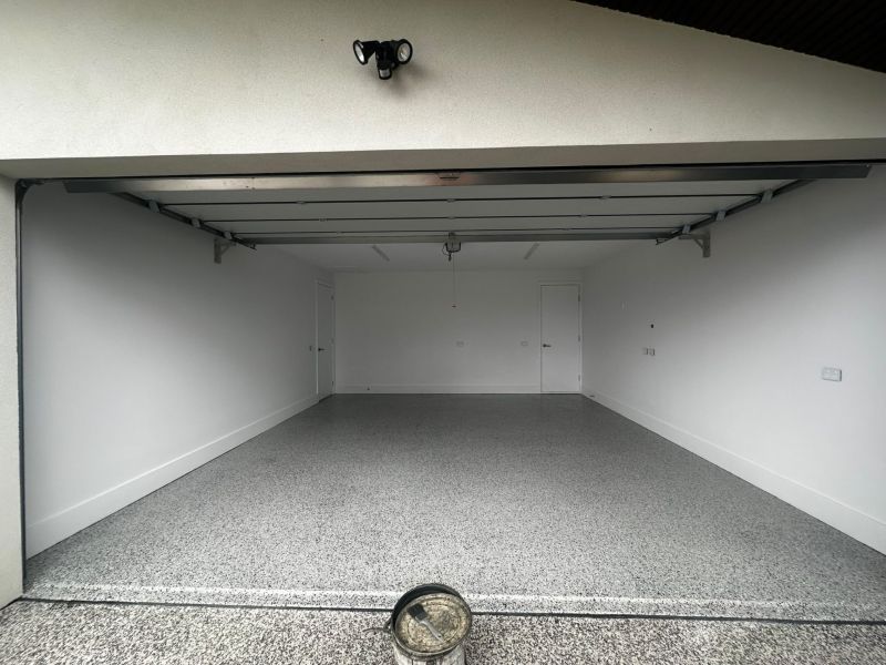 Double garage flake epoxy floor seen from driveway