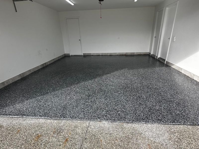 Double garage epoxy floor black and white flake