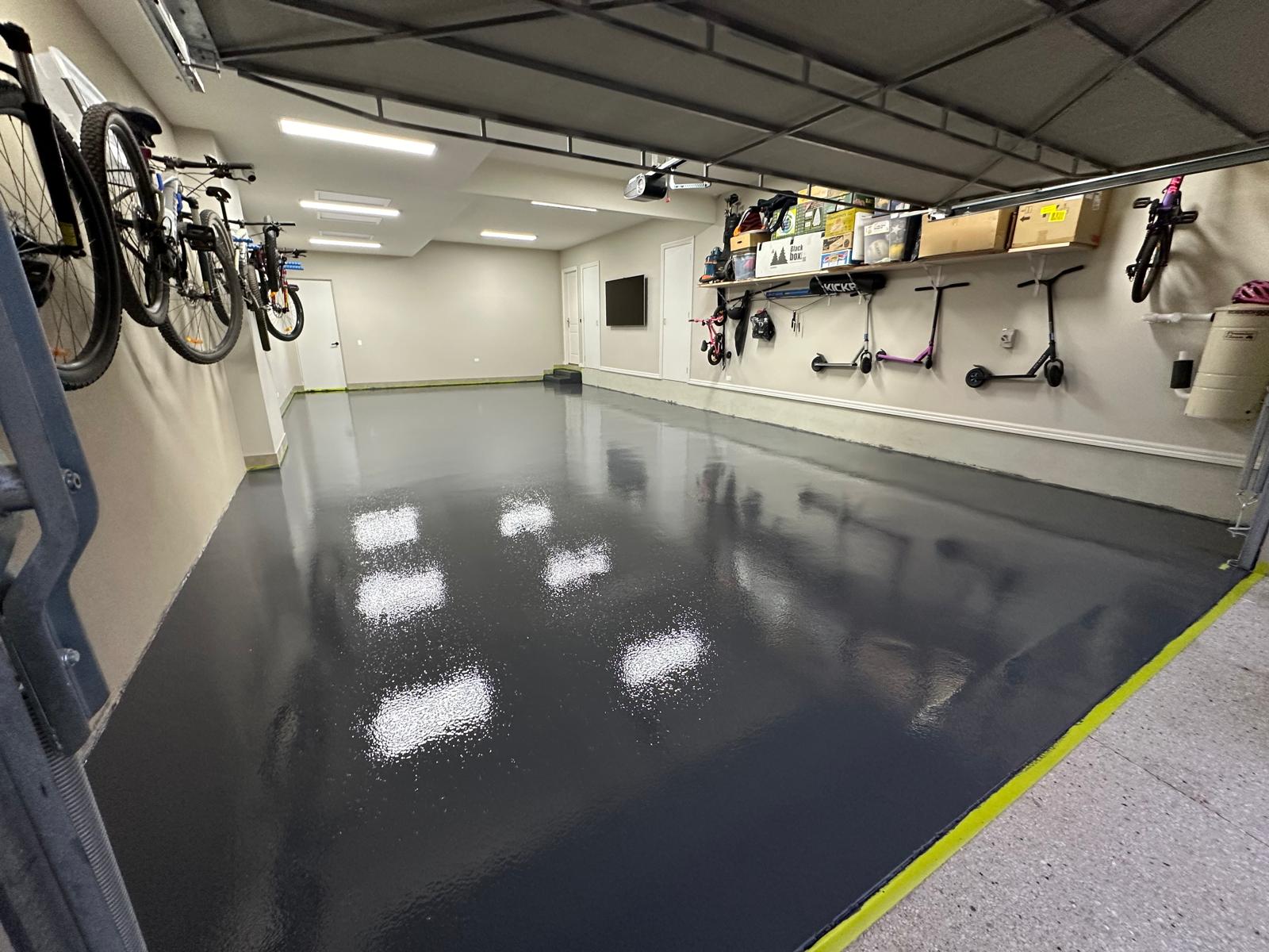 Charcoal high-gloss epoxy floor in a three-car garage in Heidelberg, Melbourne