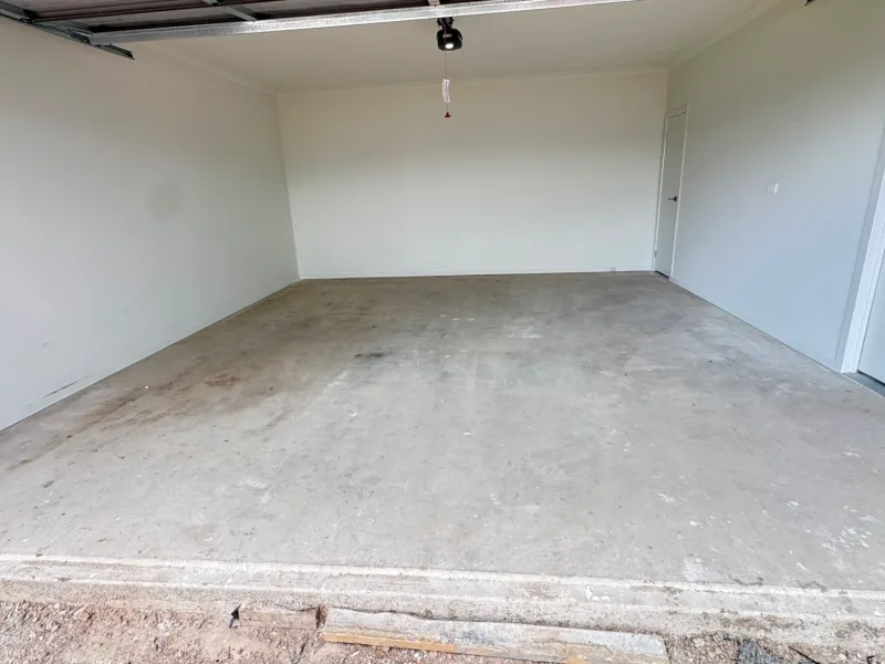 Officer double garage bare concrete slab before epoxy