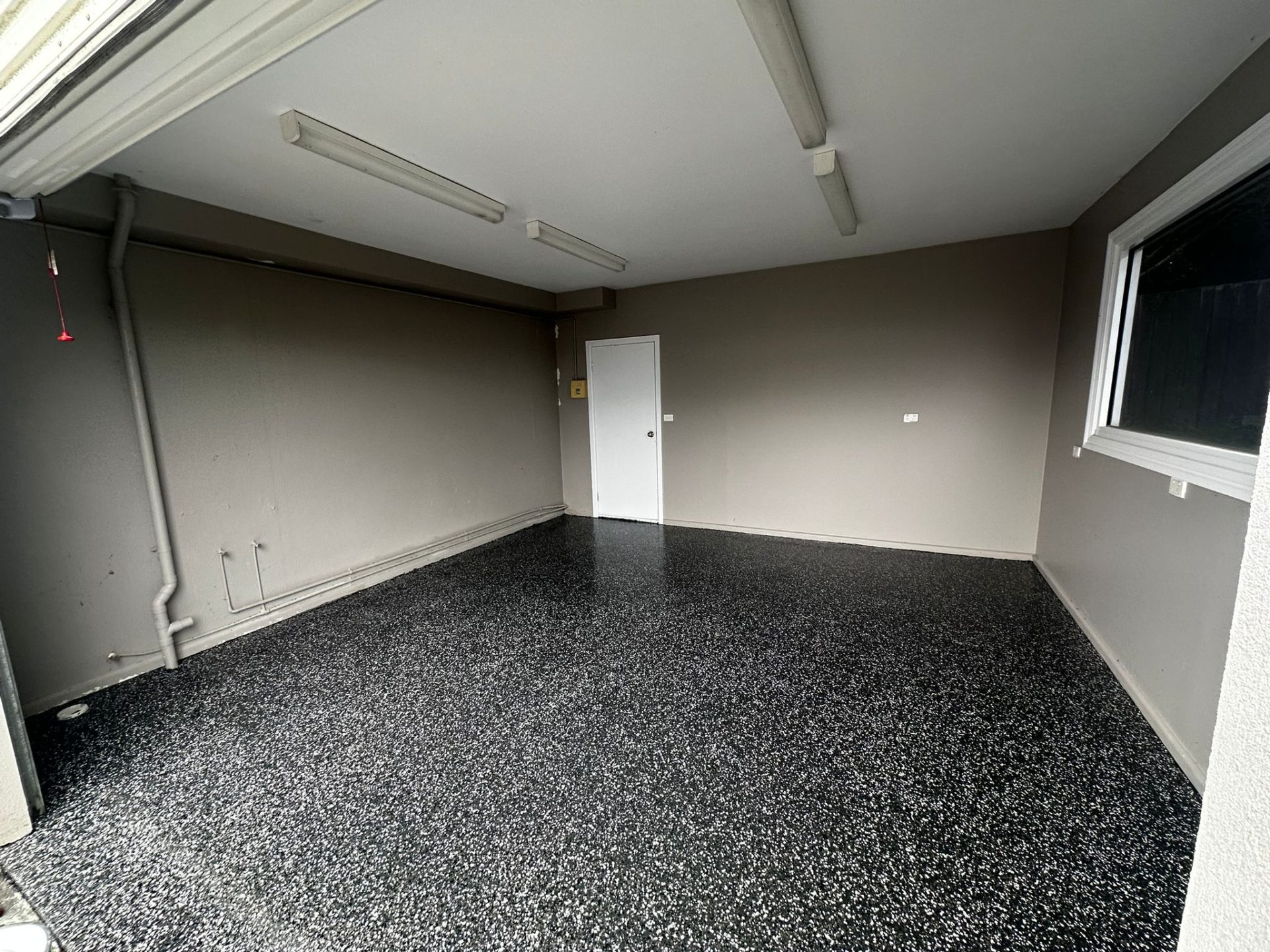 Single garage epoxy flooring black white flake Melbourne