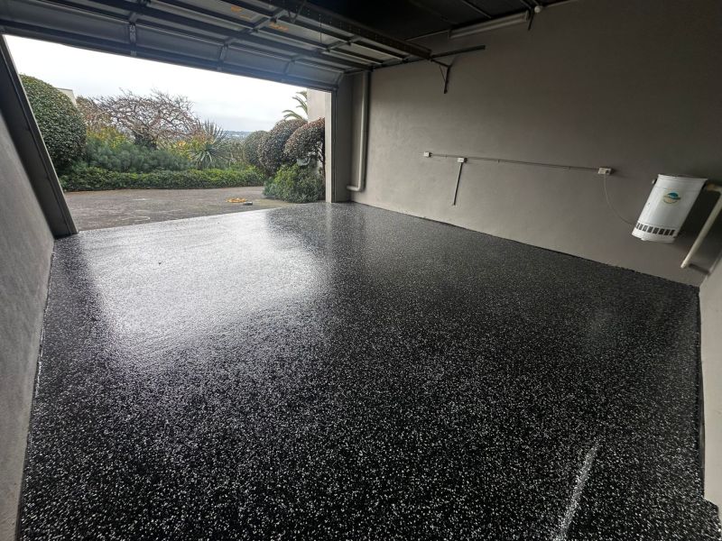 Single garage epoxy floor looking out to driveway