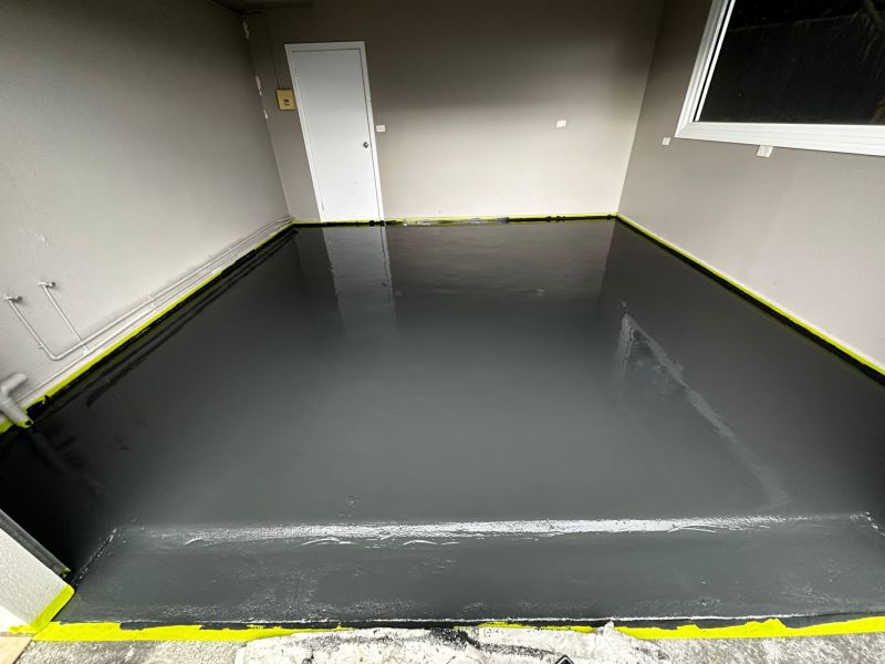 Single garage epoxy base coat before flake broadcast